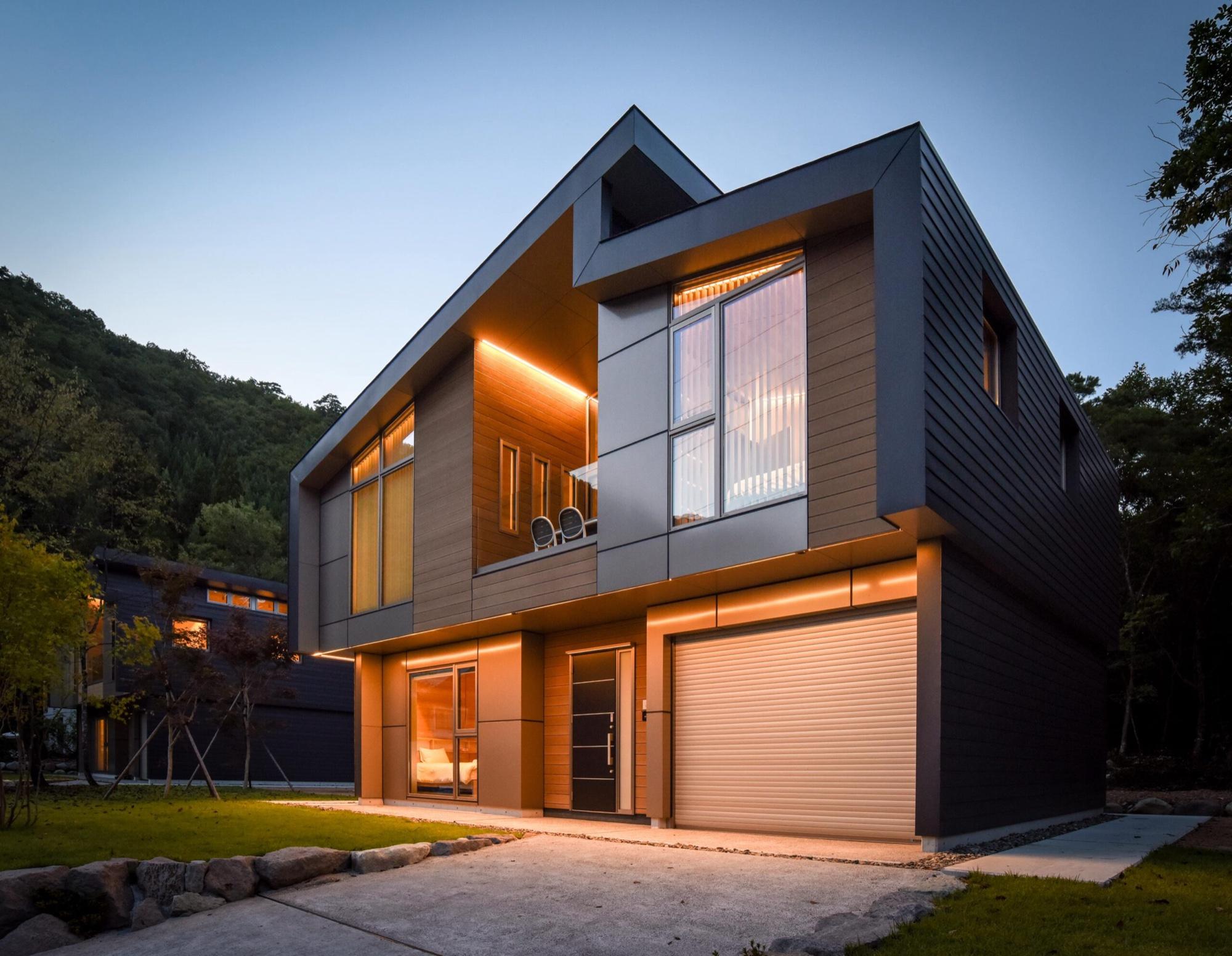 A modern alpine residence at dusk